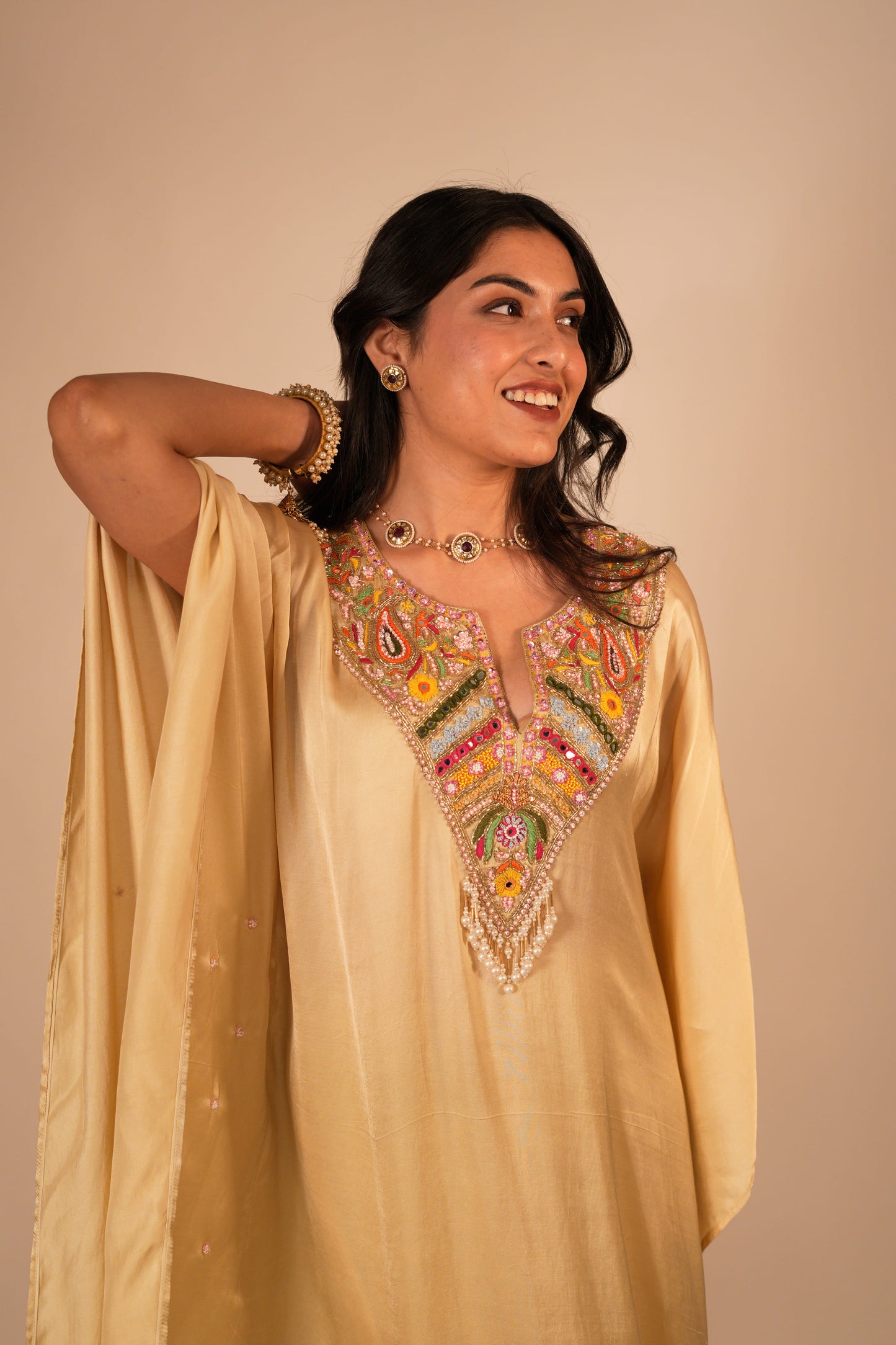 Champagne kaftan set with a hand embroidered colorful neckline