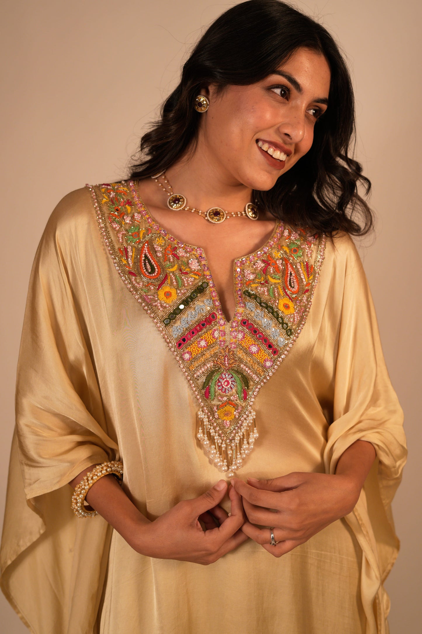 Champagne kaftan set with a hand embroidered colorful neckline
