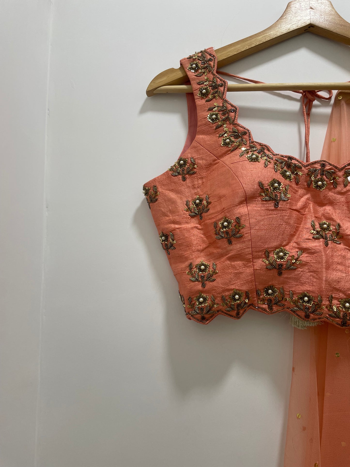 Baby pink hand embroidered blouse and dupatta with a high waisted floral printed lehenga