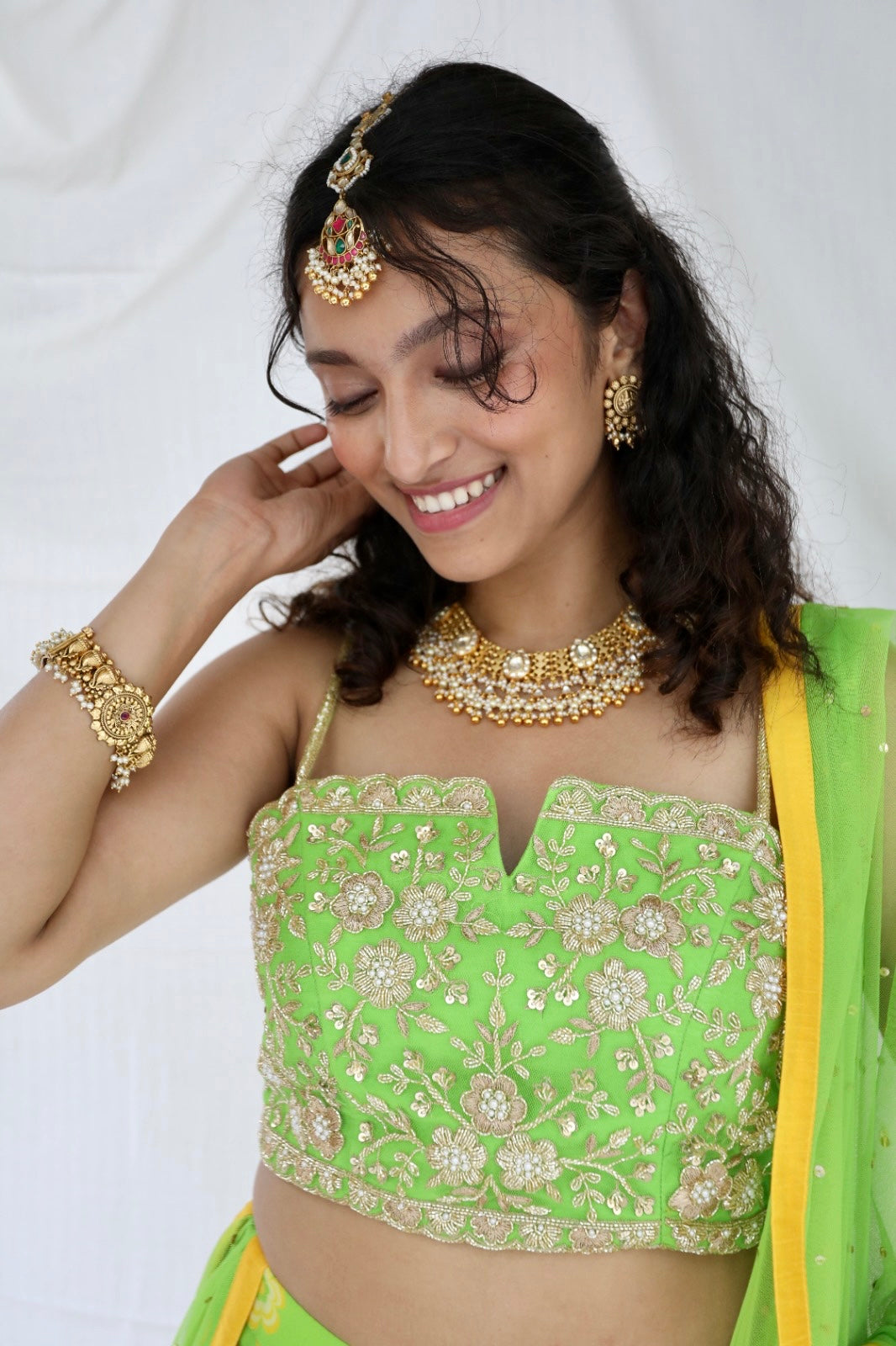 Lime green lehenga set with a hand embroidered blouse and dupatta