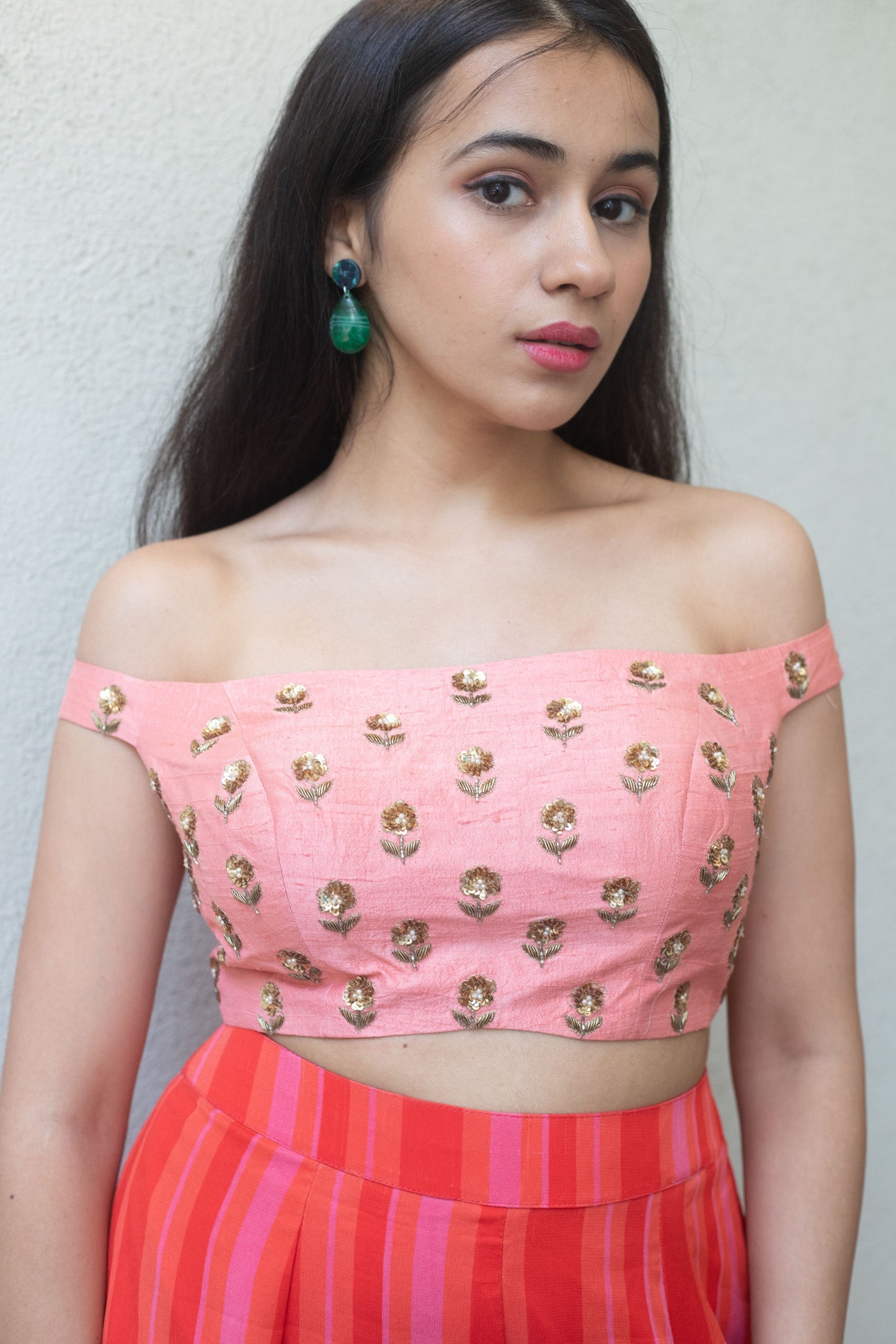 Hand embroidered off shoulder crop with a high waisted striped pant