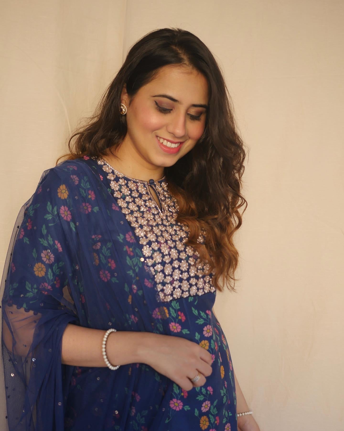Navy blue floral printed kurta with a hand embroidered yoke, pyjama and dupatta