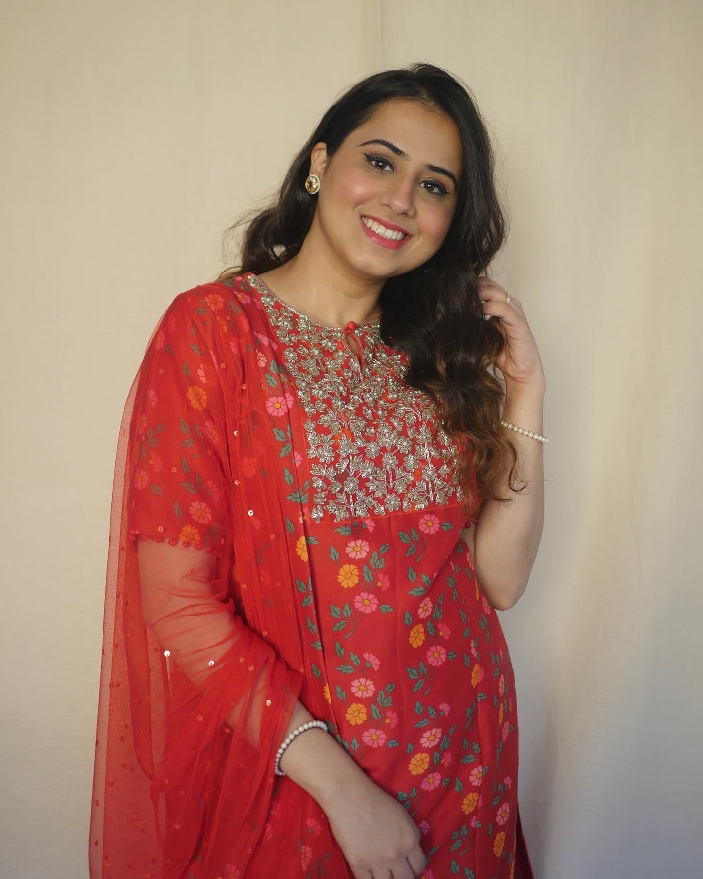Red floral printed kurta with a hand embroidered yoke, pyjama and dupatta