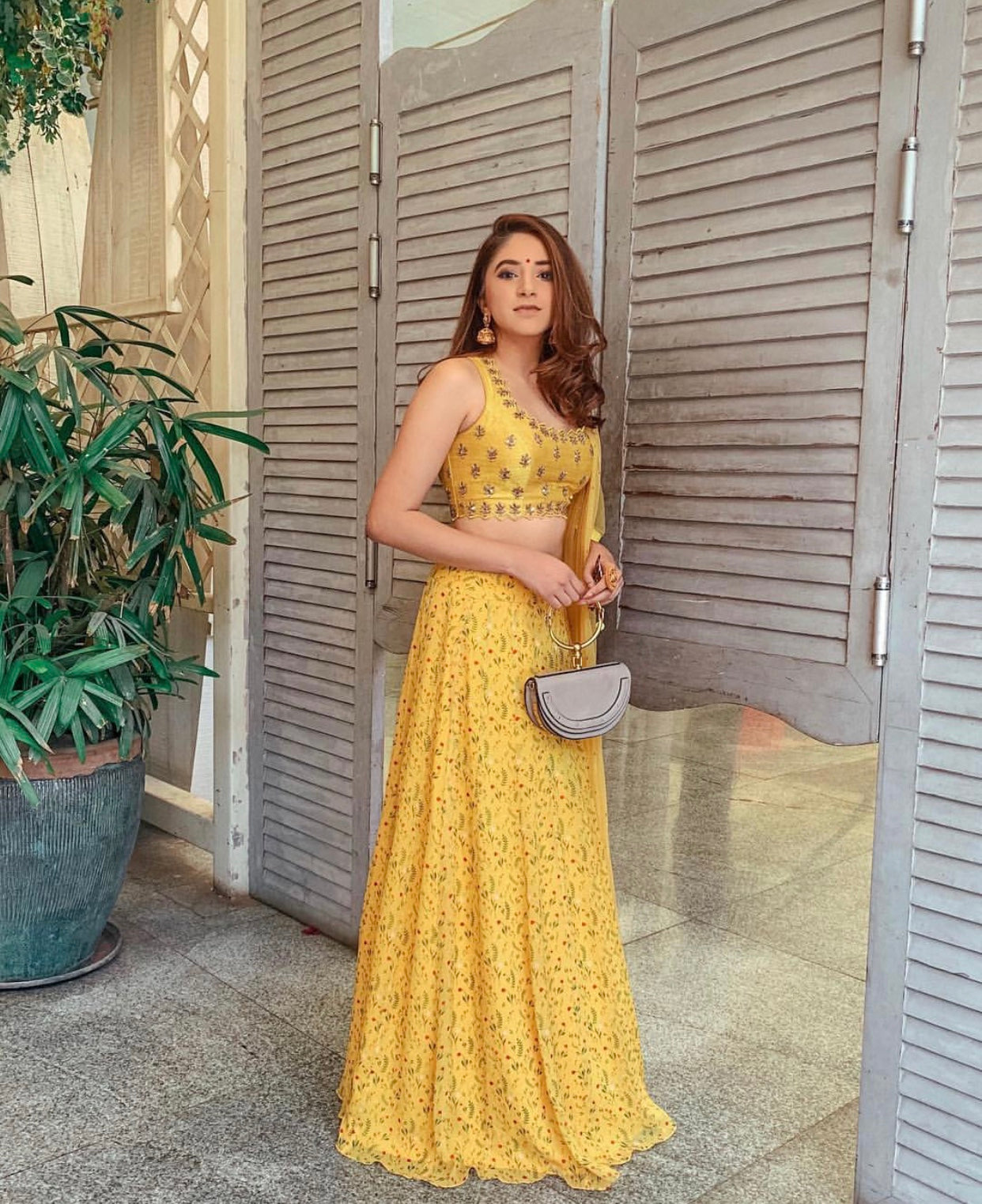 Fashion blogger- Aashna Shroff : Floral printed yellow lehenga with a hand embroidered sleeveless blouse and dupatta