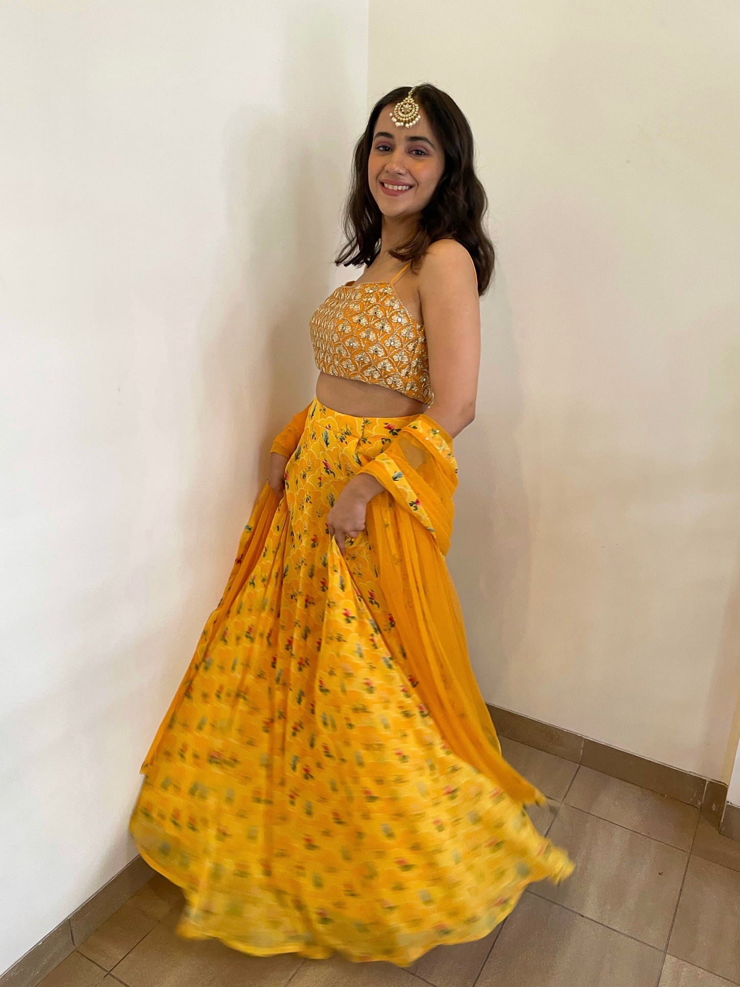 Hand embroidered blouse with a high waisted floral printed lehenga and dupatta