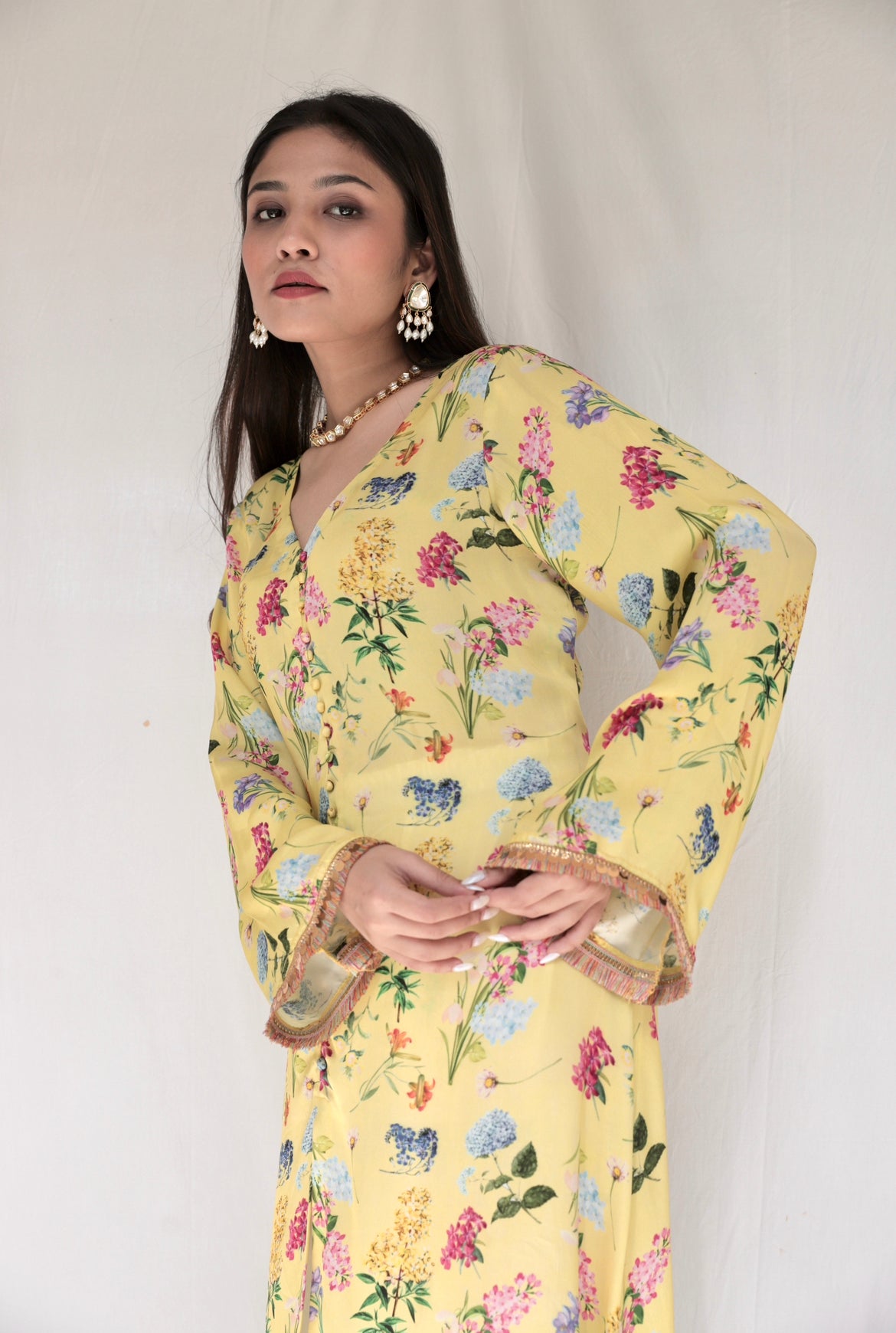 Floral printed yellow kurta and cream pyjama with colourful lace detailing