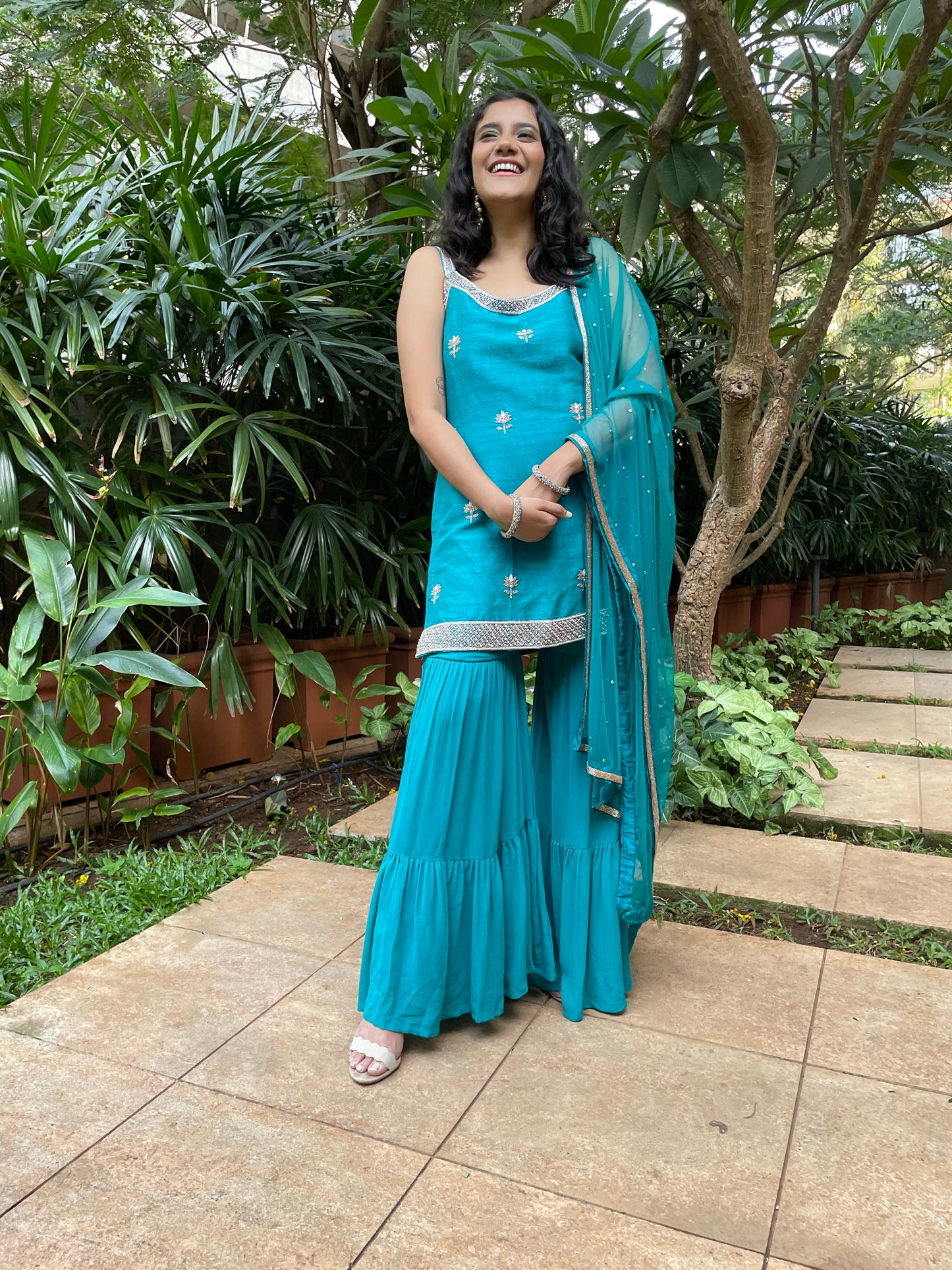 Peacock blue hand embroidered kurta and dupatta with a layered gharara