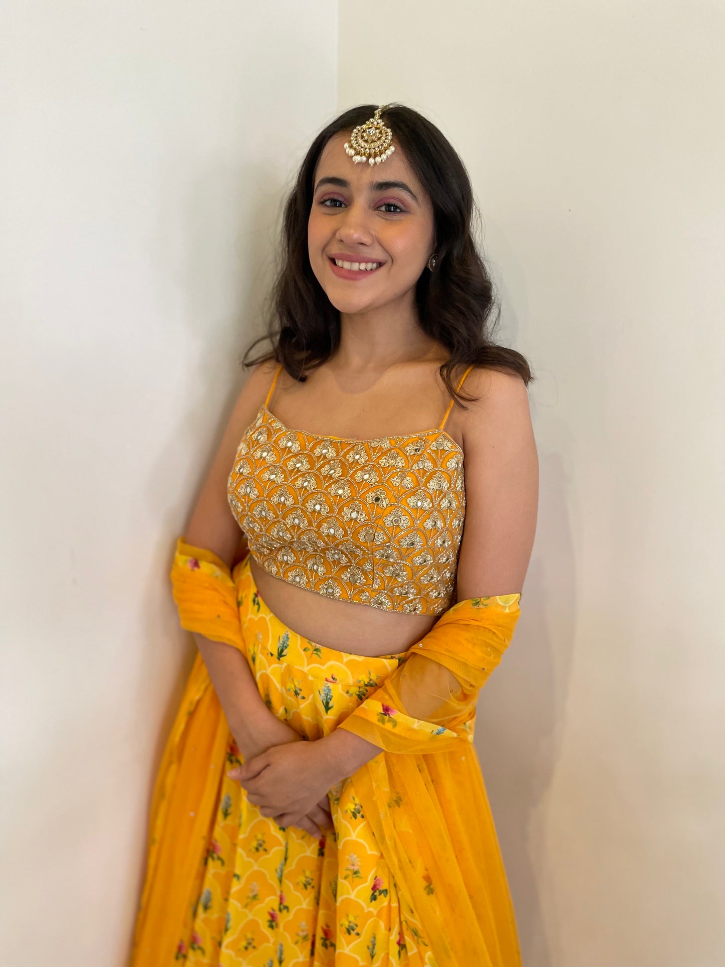 Hand embroidered blouse with a high waisted floral printed lehenga and dupatta