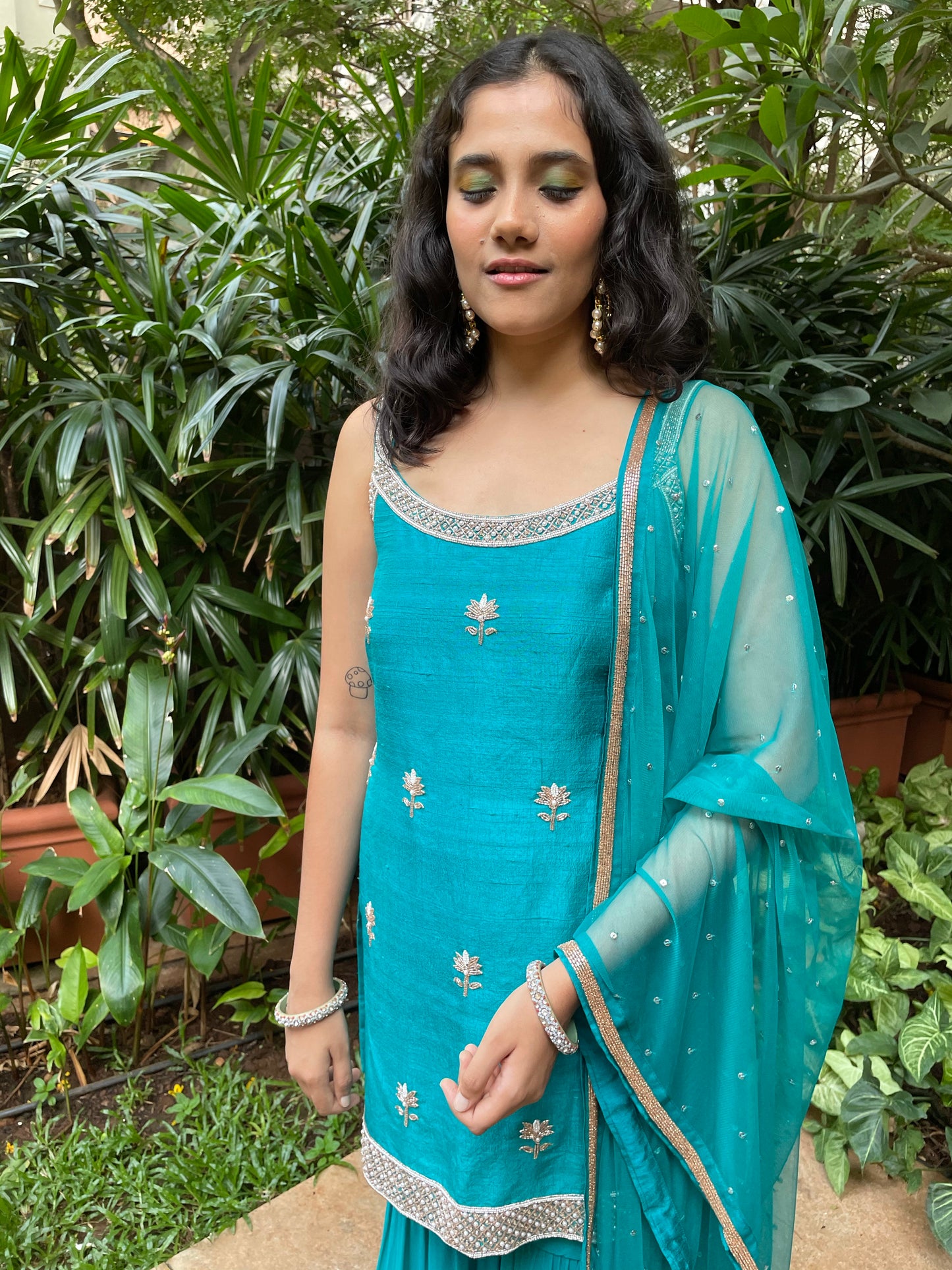Peacock blue hand embroidered kurta and dupatta with a layered gharara