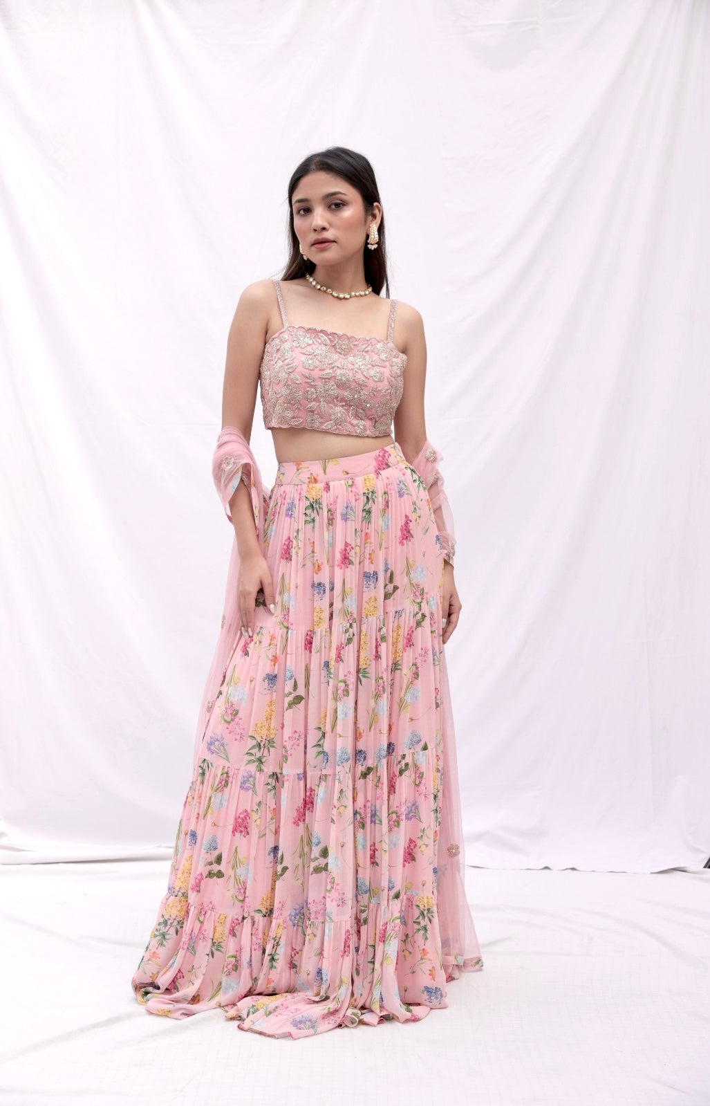 Dusty pink floral printed layered lehenga with a rose gold hand embroidered blouse and dupatta