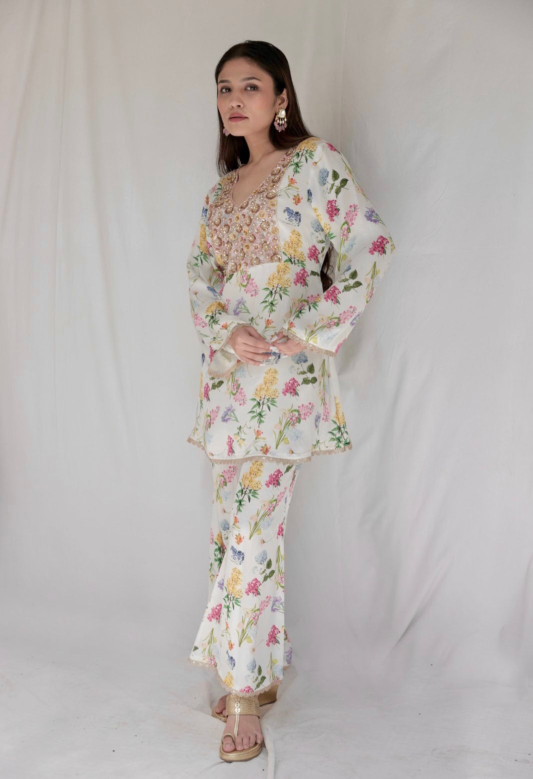 Ivory floral printed kurta with a hand embroidered yoke and flared pants