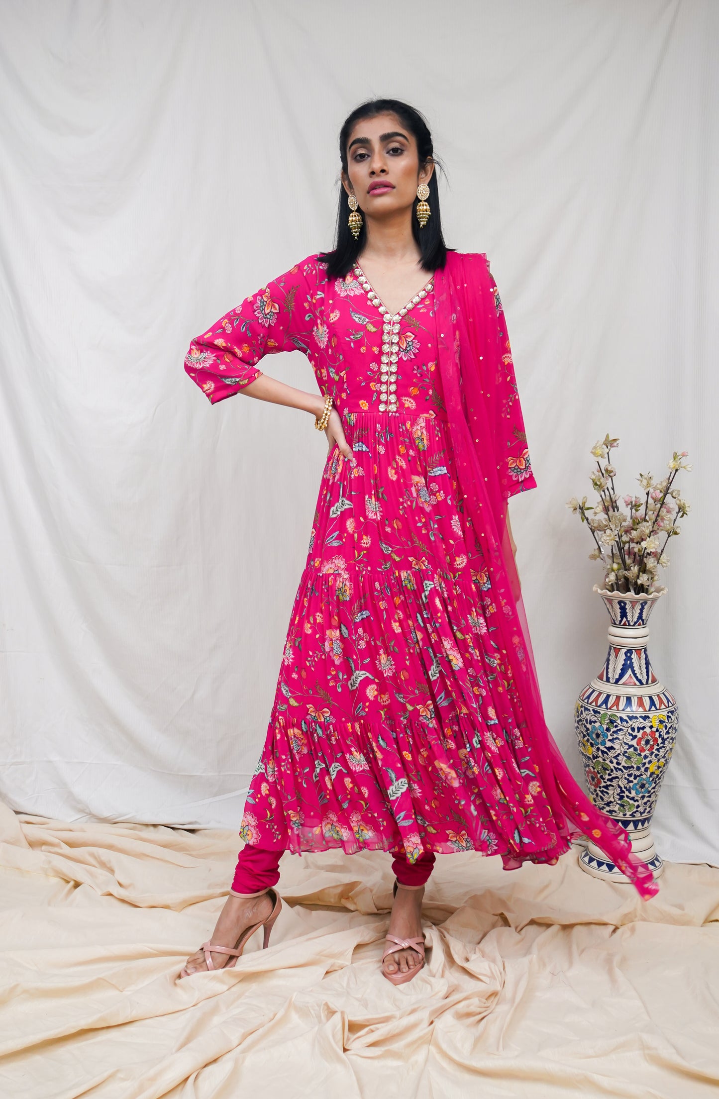 Rani pink layered anarkali set with an embroidered yoke and dupatta