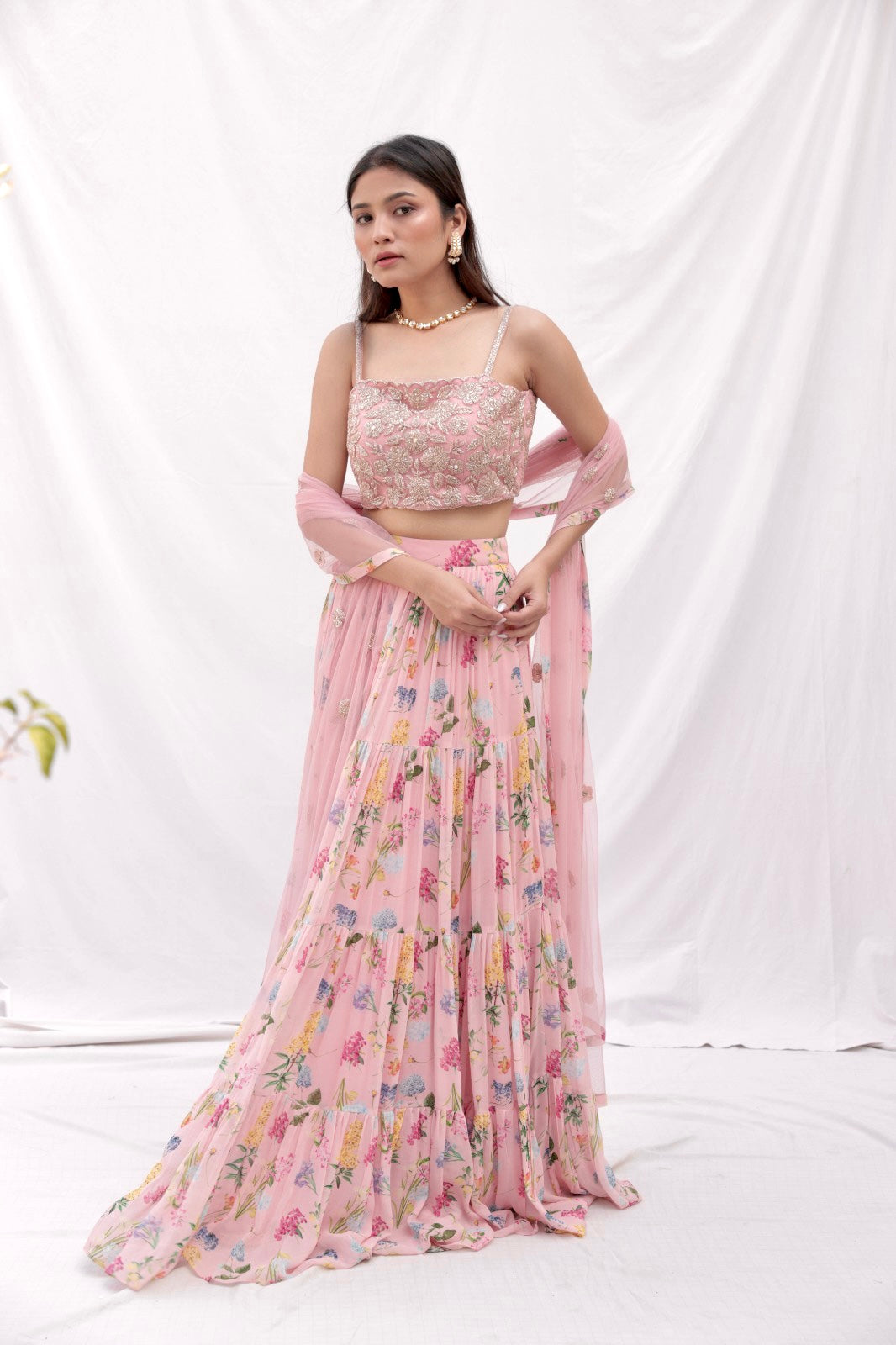 Dusty pink floral printed layered lehenga with a rose gold hand embroidered blouse and dupatta