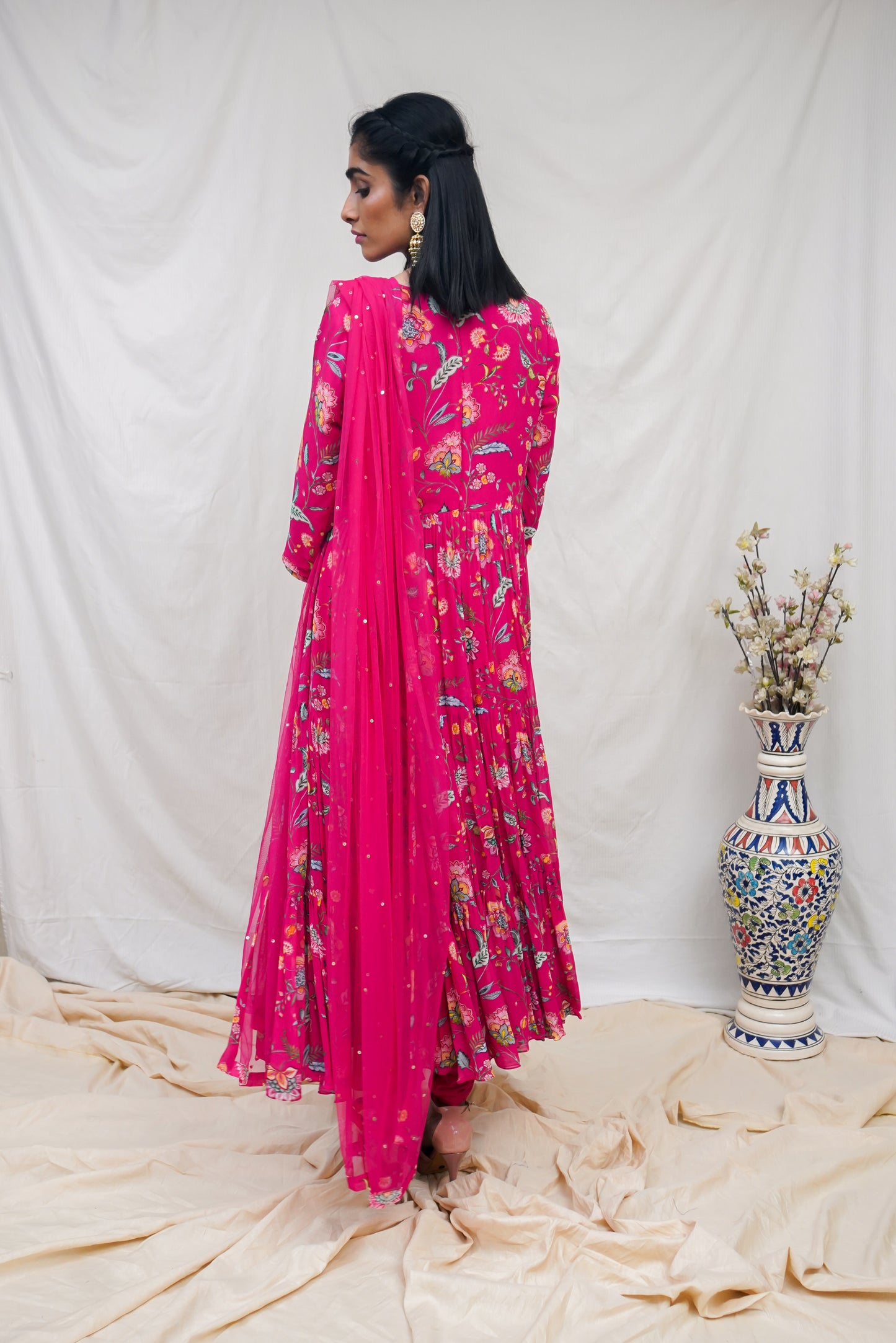 Rani pink layered anarkali set with an embroidered yoke and dupatta