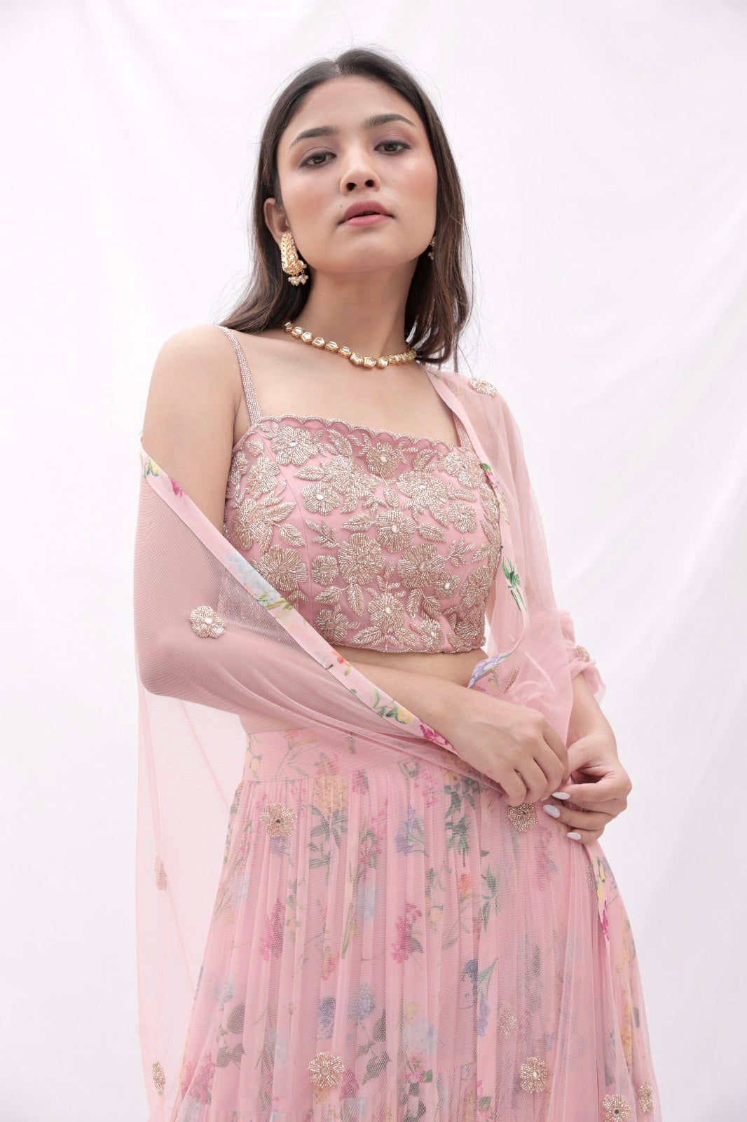 Dusty pink floral printed layered lehenga with a rose gold hand embroidered blouse and dupatta