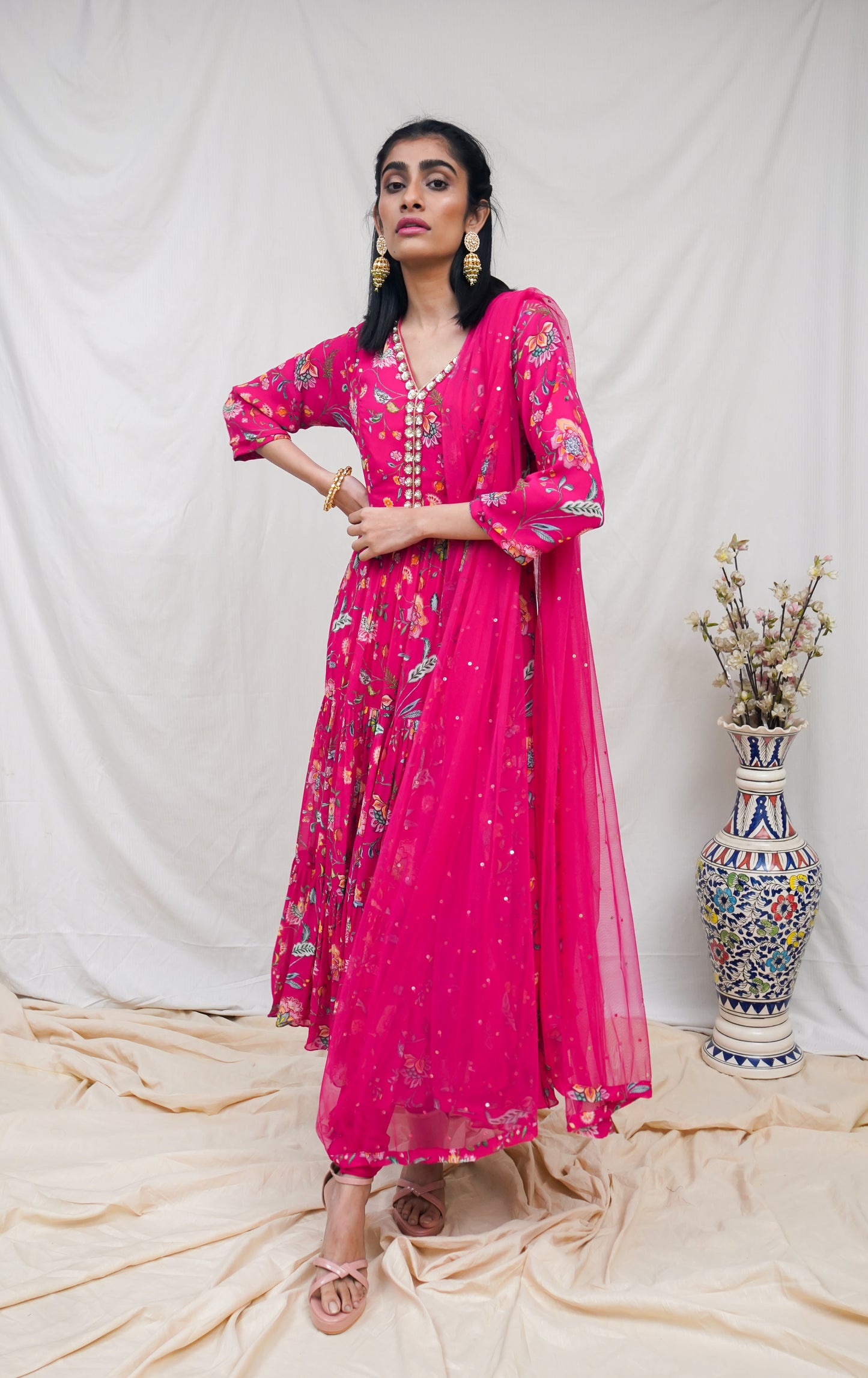 Rani pink layered anarkali set with an embroidered yoke and dupatta