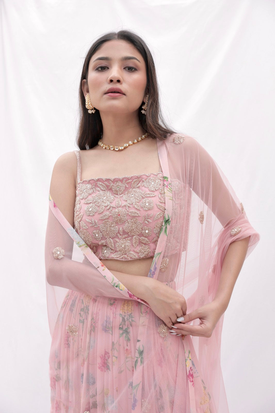 Dusty pink floral printed layered lehenga with a rose gold hand embroidered blouse and dupatta