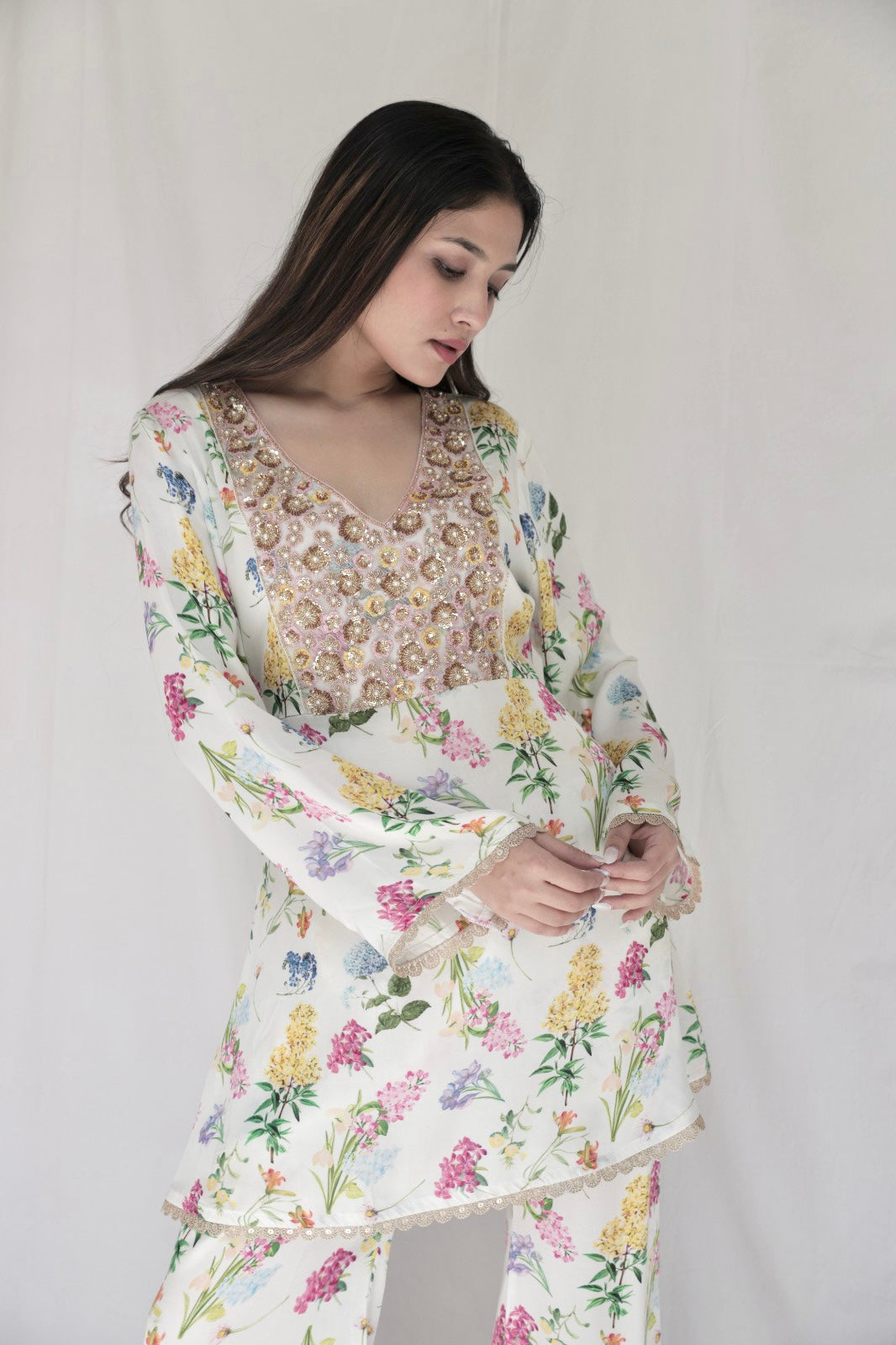 Ivory floral printed kurta with a hand embroidered yoke and flared pants