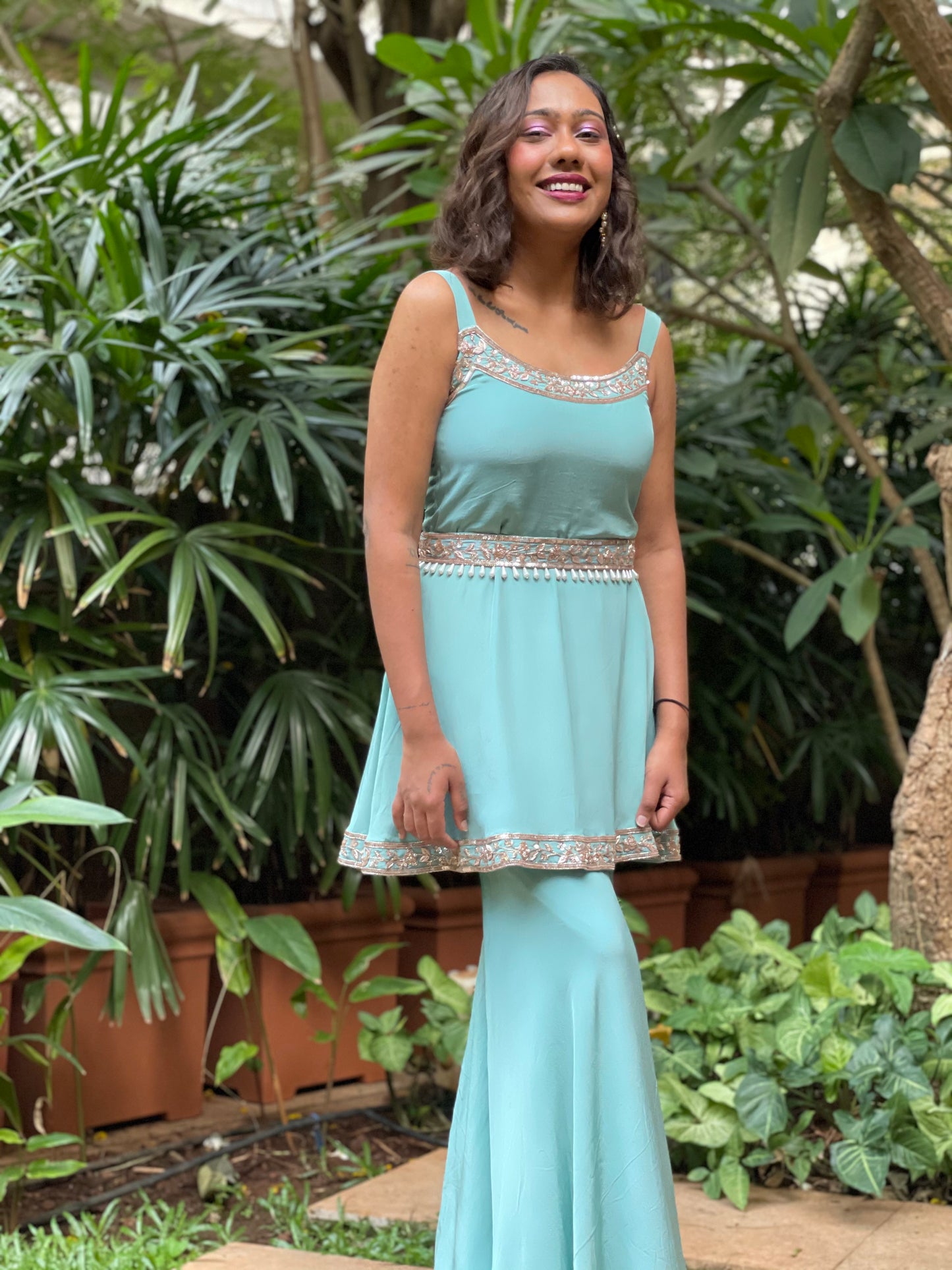 Dusty green short kurta and gharara with a hand embroidered belt