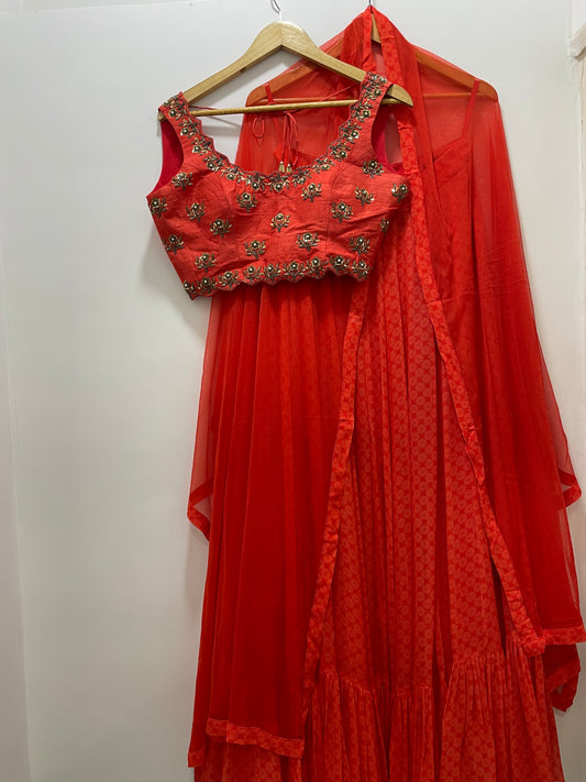 Deep red hand embroidered sleeveless blouse with a high waisted geometric floral lehenga & dupatta