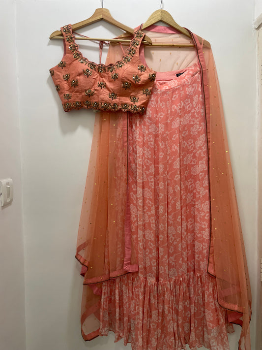 Baby pink hand embroidered blouse and dupatta with a high waisted floral printed lehenga