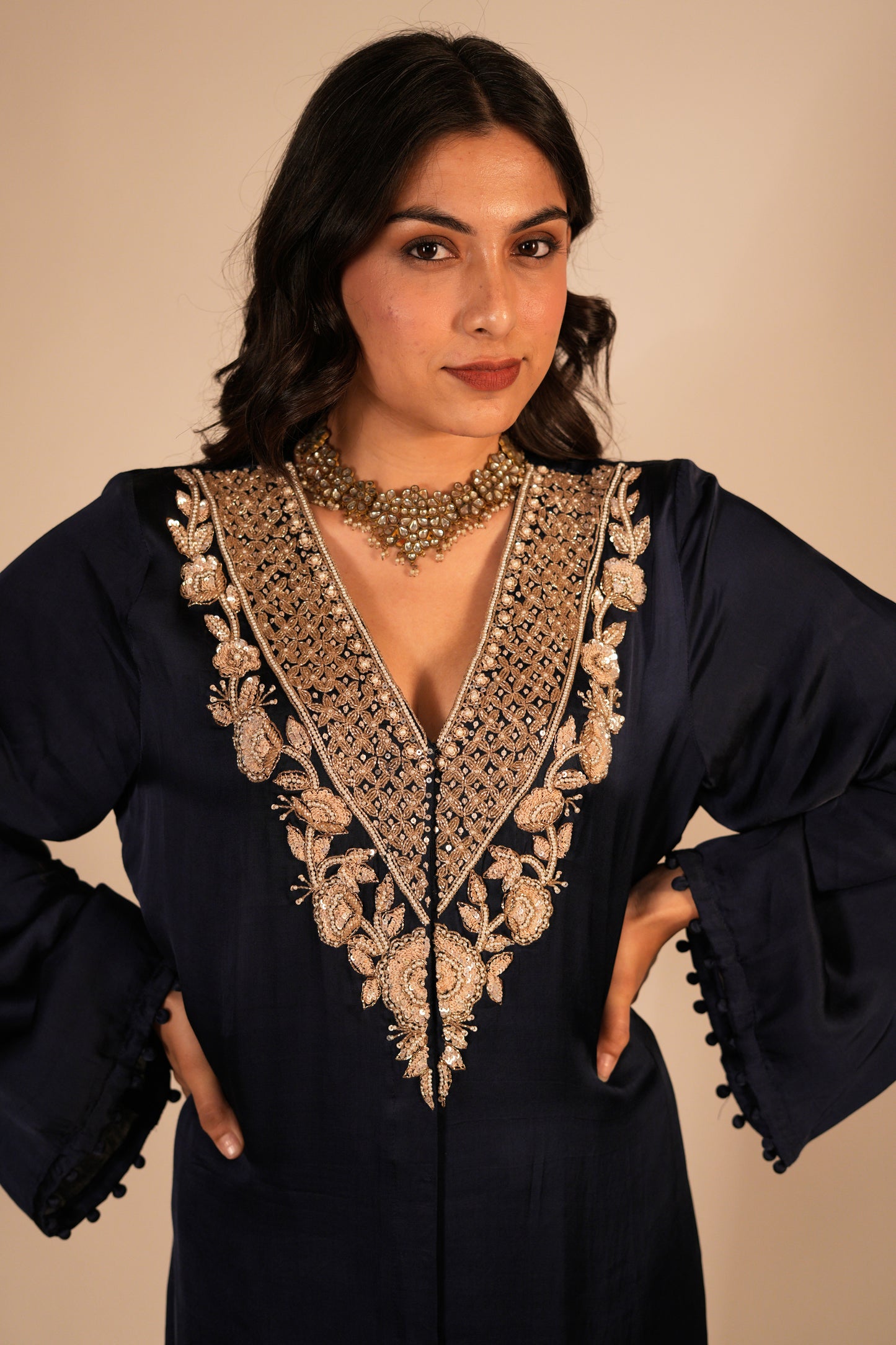 Navy blue kurta set with a hand embroidered yoke