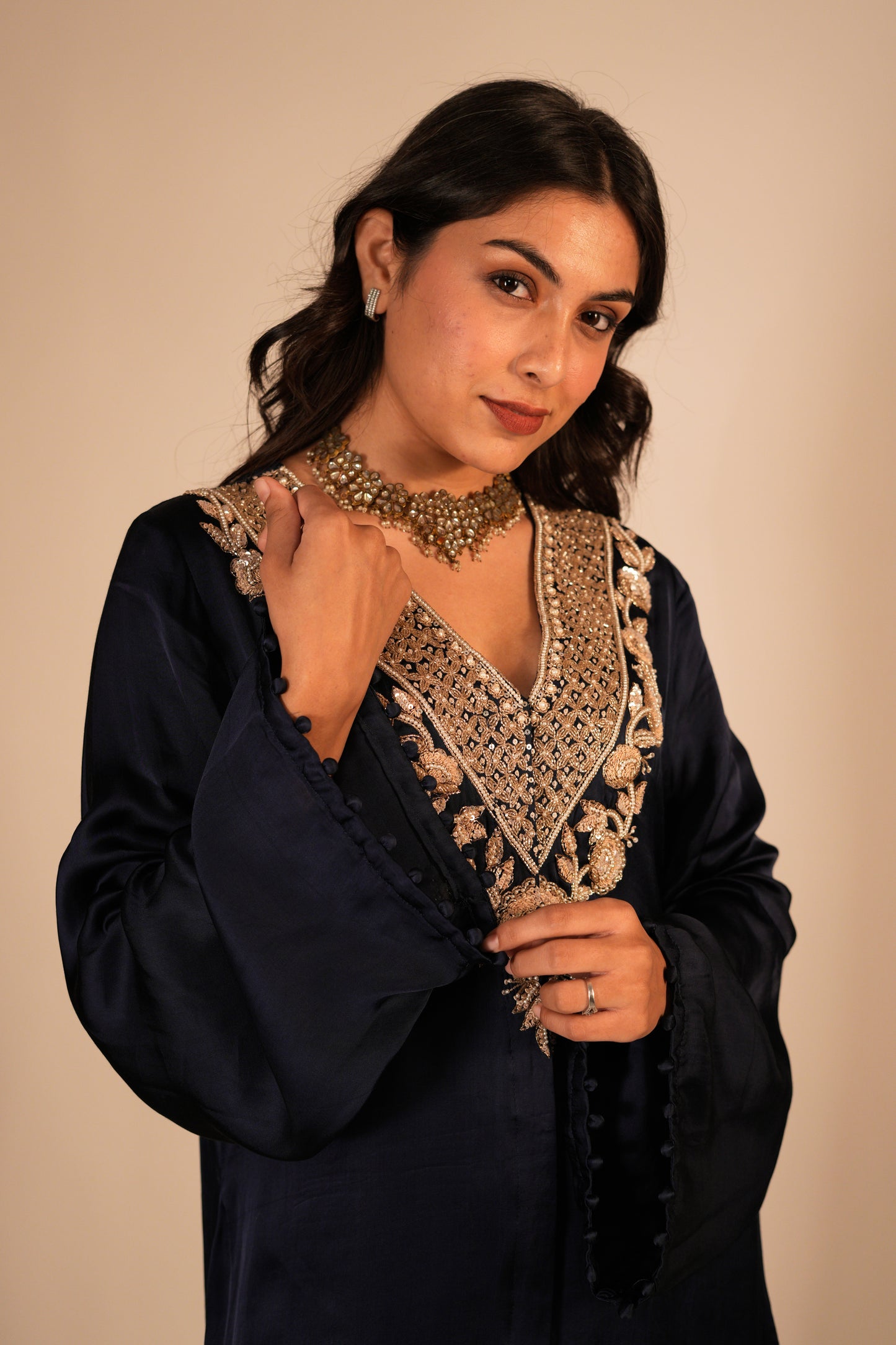 Navy blue kurta set with a hand embroidered yoke