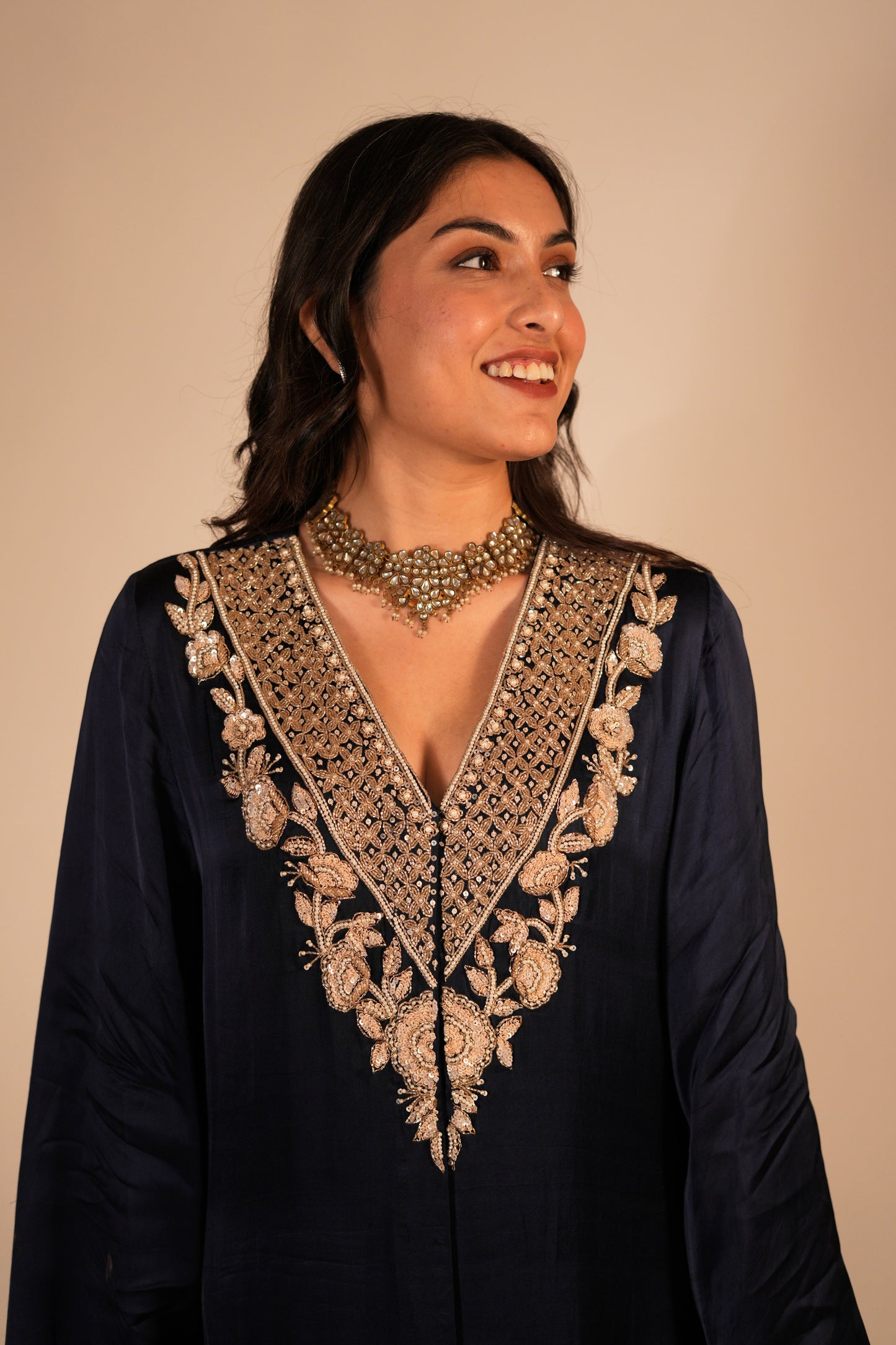 Navy blue kurta set with a hand embroidered yoke