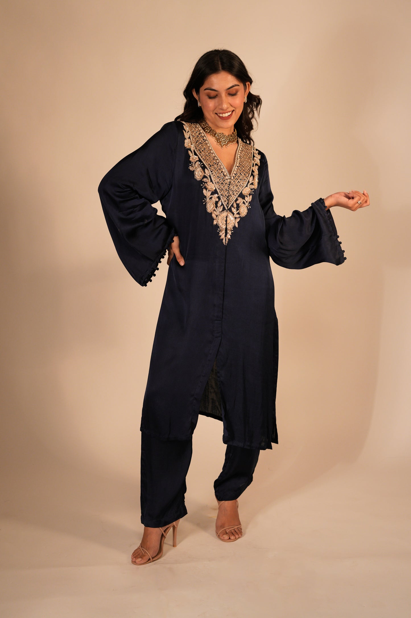 Navy blue kurta set with a hand embroidered yoke