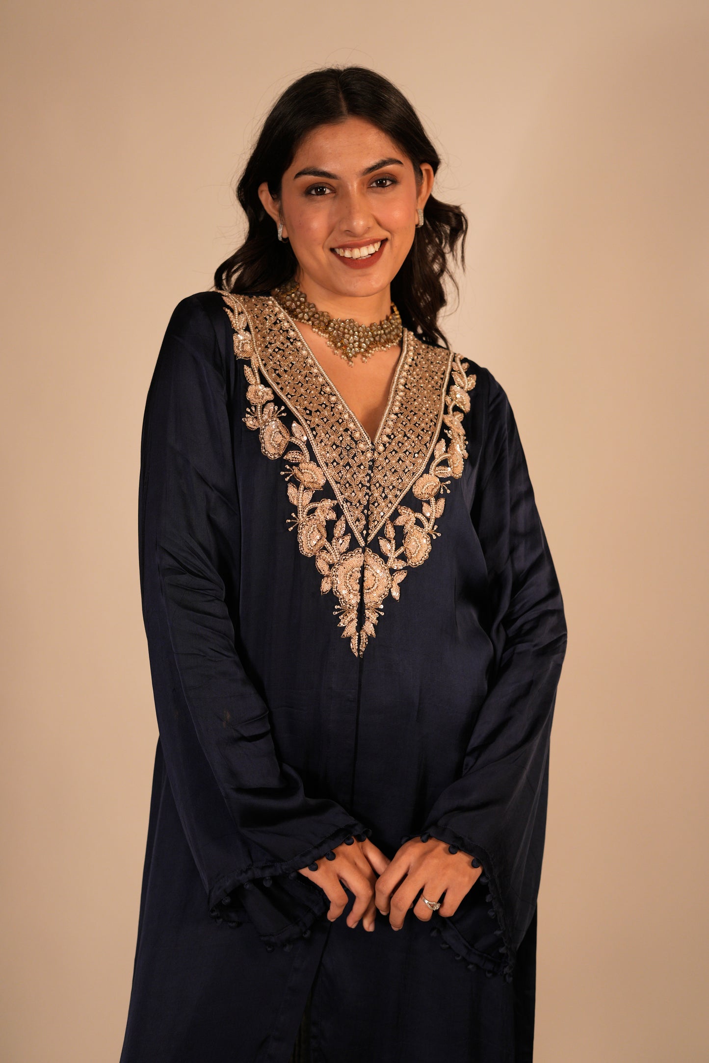 Navy blue kurta set with a hand embroidered yoke