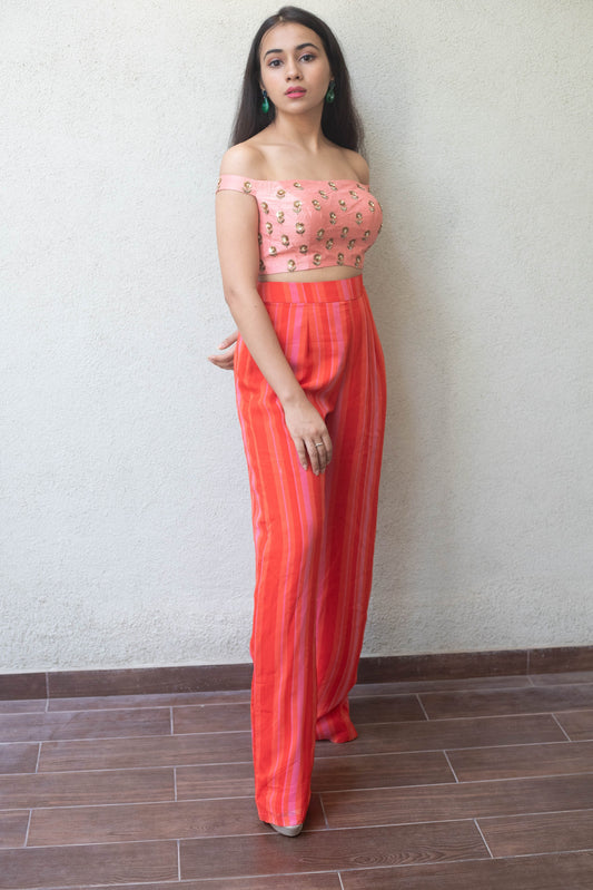 Hand embroidered off shoulder crop with a high waisted striped pant