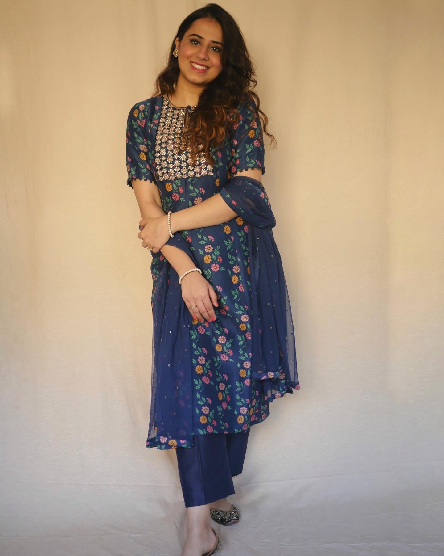 Navy blue floral printed kurta with a hand embroidered yoke, pyjama and dupatta