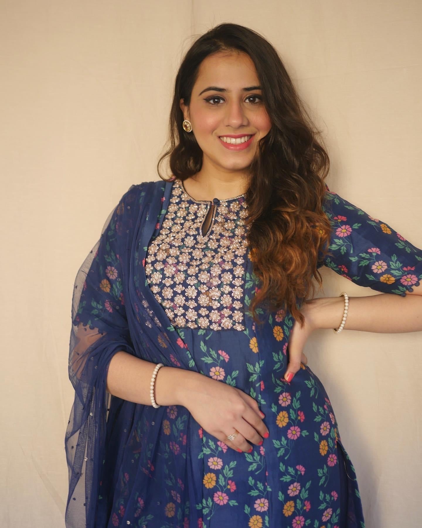 Navy blue floral printed kurta with a hand embroidered yoke, pyjama and dupatta