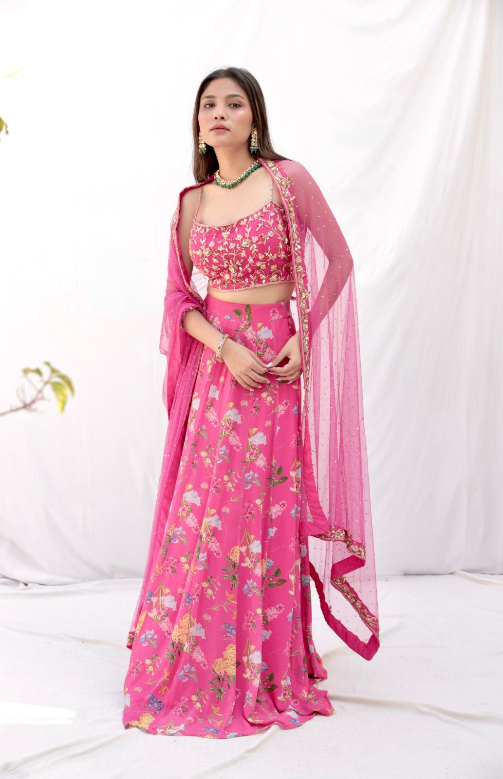 Deep pink floral printed lehenga with a hand embroidered blouse and heavy dupatta
