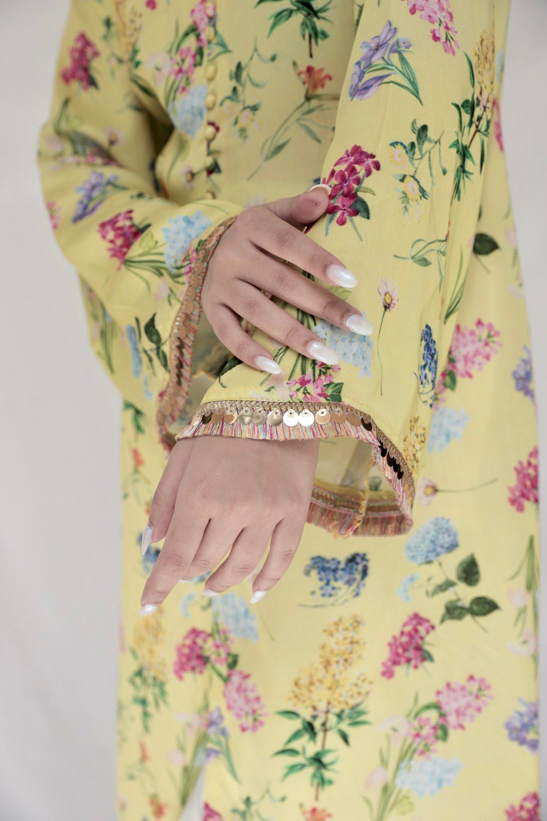 Floral printed yellow kurta and cream pyjama with colourful lace detailing