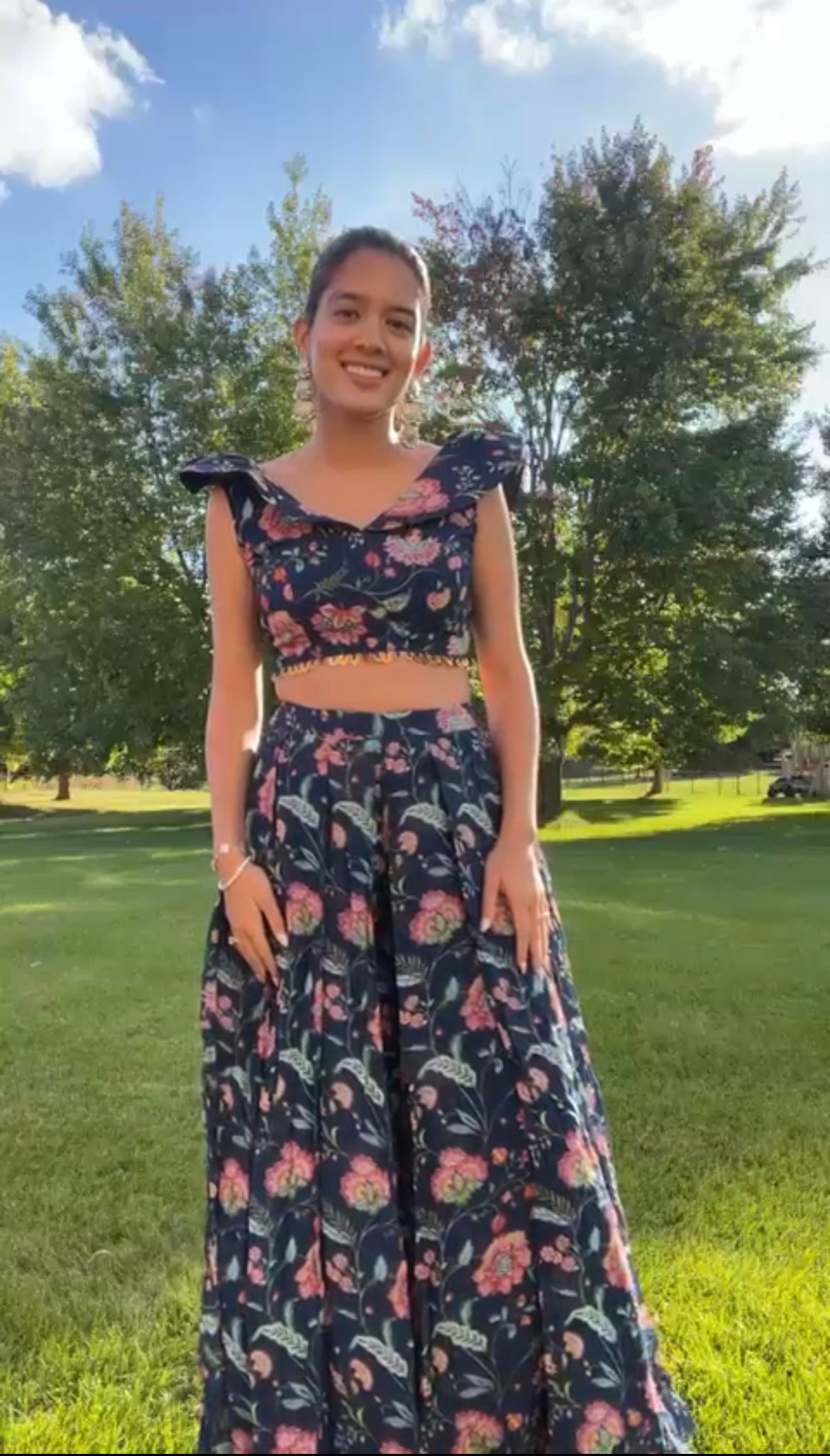 Navy blue ruffle crop top with gold embellishments and high waisted palazzo pants
