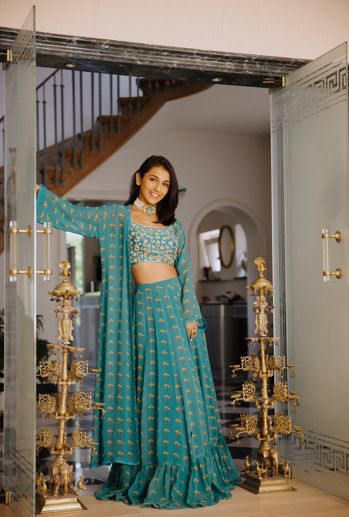 Masoom Minawala in our peacock blue floral printed lehenga and cape with an intricate hand embroidered blouse