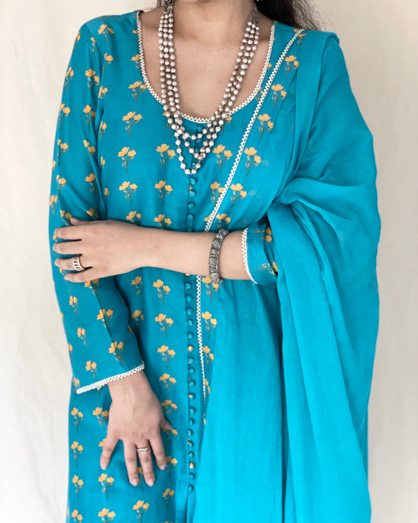 Peacock blue floral printed kurta, pyjama and dupatta with pearl edging