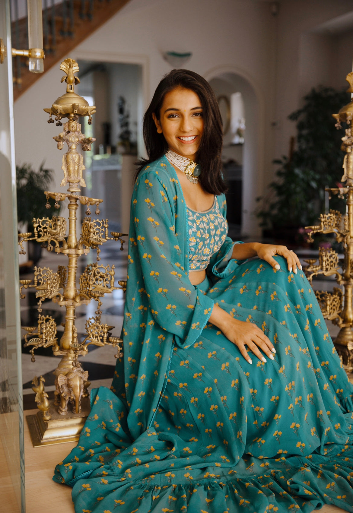 Masoom Minawala in our peacock blue floral printed lehenga and cape with an intricate hand embroidered blouse