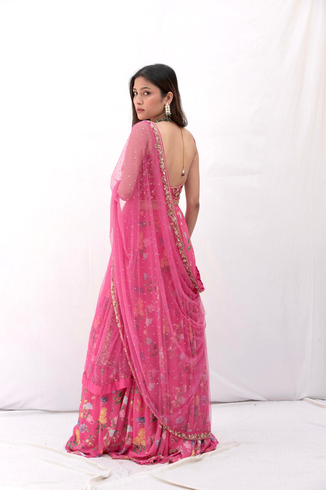 Deep pink floral printed lehenga with a hand embroidered blouse and heavy dupatta